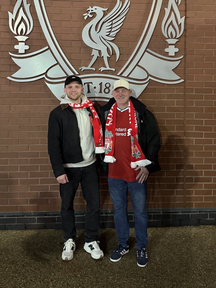 Josh at the football in Liverpool with his dad. 
